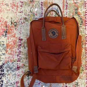 Orange 13” Fjall Raven Backpack.